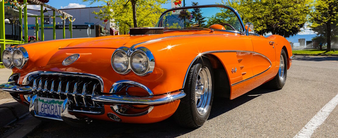 An orange 1959 Chevrolet Corvette Convertible is at summer park. Front view. Vintage Chevrolet Corvette a classic cabrio car-June 7,2022-Peachland BC Canada-Travel photo, antique cars concept